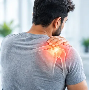 Man holding his painful shoulder